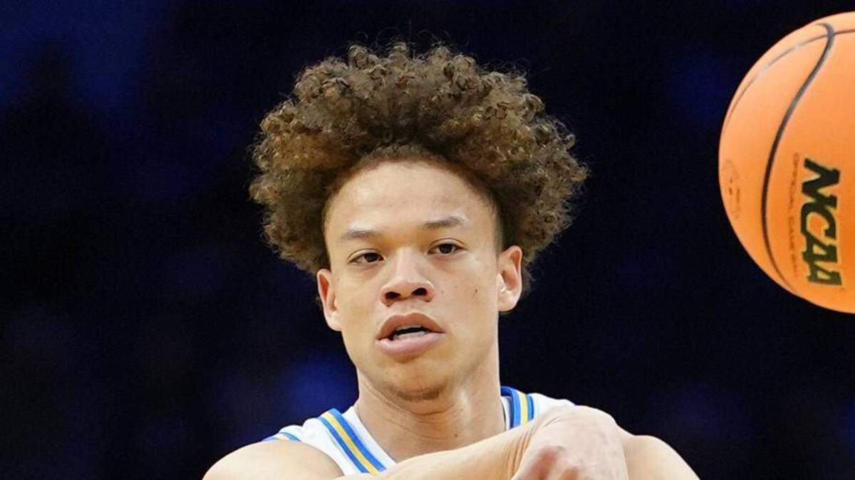  Mar 20, 2026; Philadelphia, PA, USA; UCLA Bruins guard Trent Perry (0) makes a pass against the UCF Knights in the first half during a first round game of the men's 2026 NCAA Tournament at Xfinity Mobile Arena. Mandatory Credit: Kyle Ross-Imagn Images | Kyle Ross-Imagn Images 