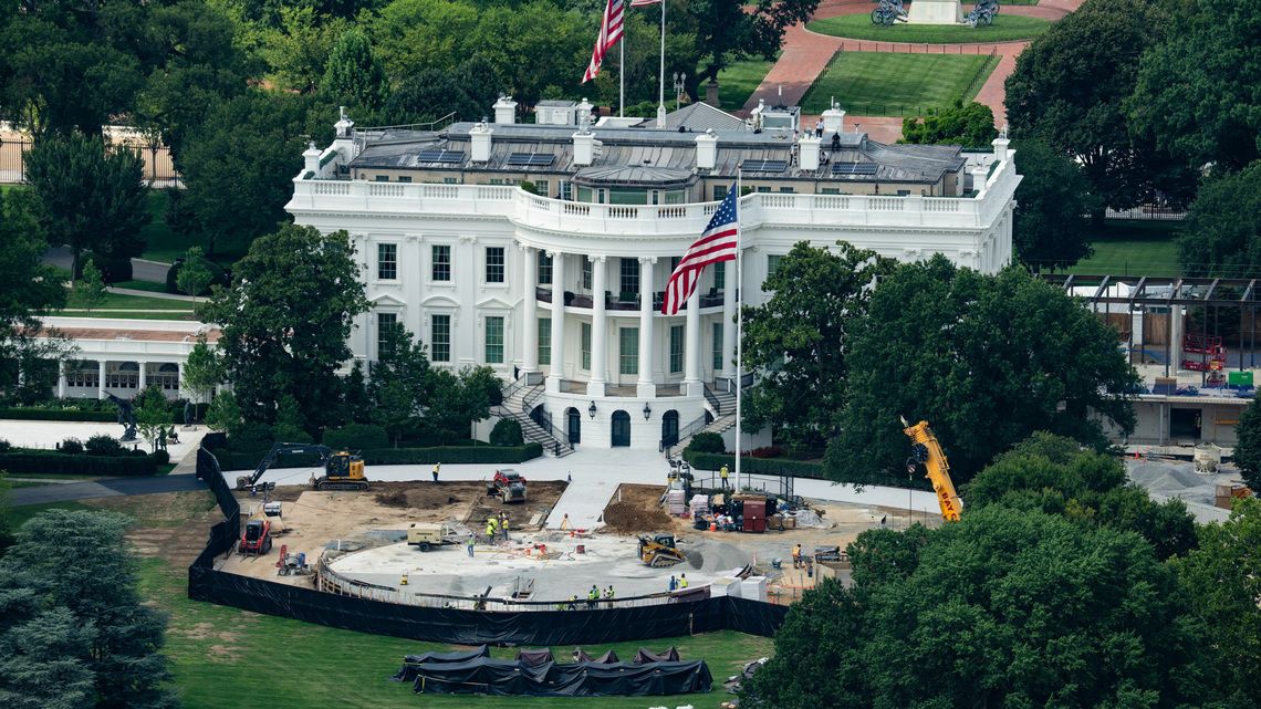 Trump the builder carves his legacy in stone as pressures mount