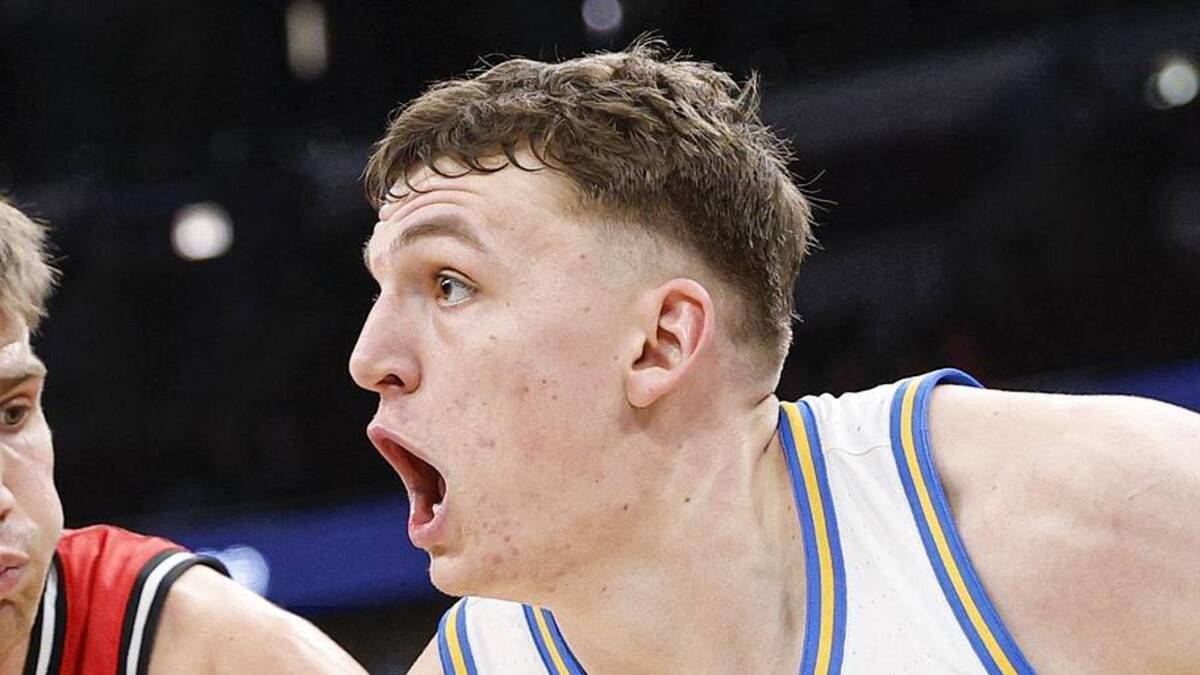  Mar 12, 2026; Chicago, IL, USA; UCLA Bruins forward Tyler Bilodeau (34) drives to the basket against Rutgers Scarlet Knights guard Harun Zrno (13) during the second half at United Center. Mandatory Credit: Kamil Krzaczynski-Imagn Images | Kamil Krzaczynski-Imagn Images 