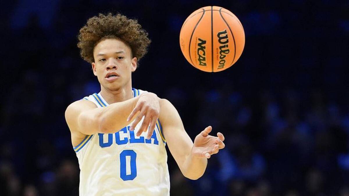  Mar 20, 2026; Philadelphia, PA, USA; UCLA Bruins guard Trent Perry (0) makes a pass against the UCF Knights in the first half during a first round game of the men's 2026 NCAA Tournament at Xfinity Mobile Arena. Mandatory Credit: Kyle Ross-Imagn Images | Kyle Ross-Imagn Images 