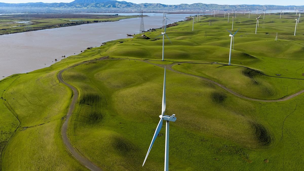 FILE PHOTO: A drone view of windmills near the Sacramento River where it enters the California Delta near Rio Vista, California, U.S. December 28, 2025. REUTERS/Fred Greaves/File photo