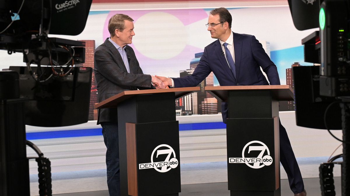 U.S. Sen. Michael Bennet, left, and Attorney General Phil Weiser, both running for the Democratic nomination for governor of Colorado, shake hands after a debate at the Denver7 studios on May 7, 2026, in Denver. (RJ Sangosti/The Denver Post/TNS)