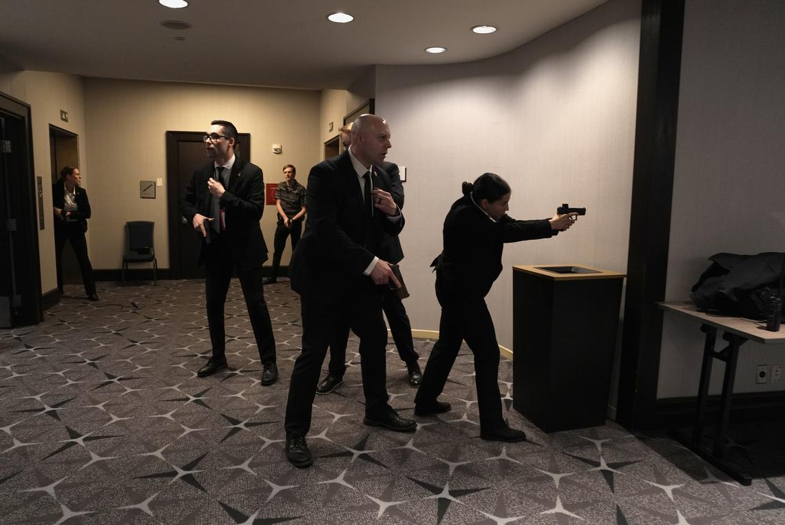 Secret Service agents with drawn weapons at the Washington Hilton where the White House Correspondents' Association dinner was being held, in Washington on Saturday, April 25, 2026. President Trump was rushed out of the White House correspondents' dinner on Saturday night after reports of gunfire. (Salwan Georges/The New York Times)