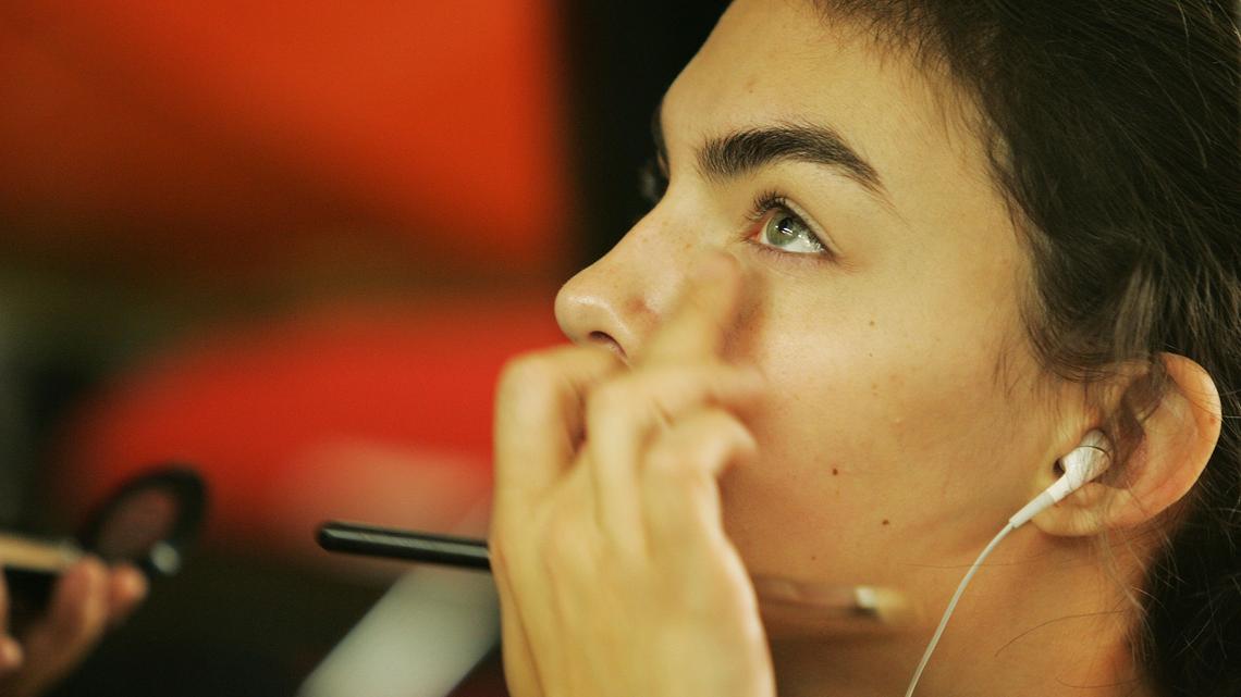NEW YORK - FEBRUARY 08:  A model gets ready backstage at the Yeohlee Fall 2006 Show fashion show during Olympus Fashion Week February 8, 2006 in New York City.  (Photo by Paul Hawthorne/Getty Images)