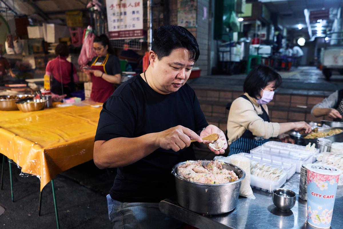 Hung Ming-he, who leads the organization that runs the market and owns a nearby stall famous for its pork dumplings, at the Xizhou Public Market, one of the oldest traditional food markets in the Taipei, Taiwan, folds dumplings on April 8, 2026. Plastic producers in Taiwan have scrambled to secure new supplies since the war in Iran disrupted petrochemical flows and tightened availability. (An Rong Xu/The New York Times)