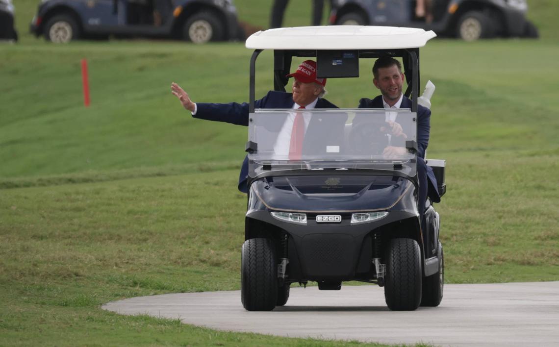  DORAL, FLORIDA - APRIL 03: U.S. President Donald Trump and his son, Eric Trump, drive in a golf cart after he arrived on Marine One at the LIV Golf tournament being held at his Trump National Doral Golf Club on April 03, 2025 in Doral, Florida. Yesterday, Trump declared a U.S. economic emergency and announced sweeping tariffs of at least 10%, with rates even higher for 60 countries that have a high trade deficit with the U.S. The tariffs will affect electronics, automobiles, clothing and shoes, wines and spirits, and Swiss watches (Photo by Joe Raedle/Getty Images) 