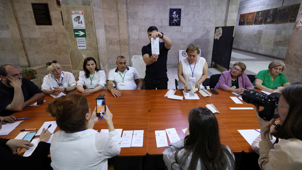 Members of an electoral commission count votes after polling stations closed in a parliamentary election in Yerevan, Armenia, June 7, 2026. Vahram Baghdasaryan/Photolure via REUTERS