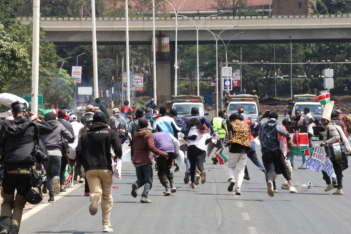 Protesters run as police officers use tear gas to disperse them during demonstrations to mark the second anniversary of the deadly 2024 anti-government protests, in Nairobi, Kenya, June 25, 2026. REUTERS/Monicah Mwangi