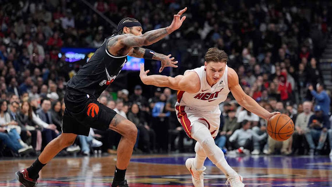  Apr 9, 2026; Toronto, Ontario, CAN; Miami Heat forward Pelle Larsson (9) drives to the basket against Toronto Raptors forward Brandon Ingram (3) during the first half at Scotiabank Arena. Mandatory Credit: John E. Sokolowski-Imagn Images | John E. Sokolowski-Imagn Images 