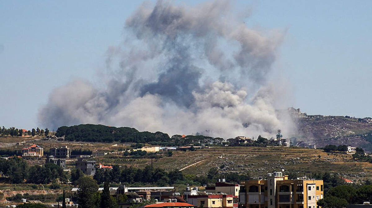 A photograph taken from the southern area of Nabatieh shows smoke rising from the site of an Israeli airstrike in the village of Kfar Tibnit, Lebanon, on Thursday. Hezbollah rejected a ceasefire plan agreed by the Lebanese and Israeli governments in U.S.-mediated talks.