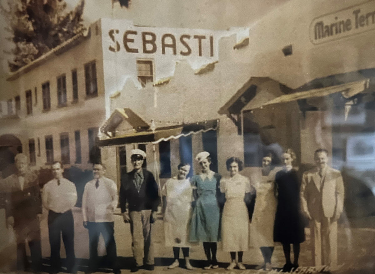This circa 1940s photo shows the Sebastian Inn staff with a man on the far right and a woman in the center in the blue dress, who may have been the owners, managers or guests. The hotel on the Indian River Lagoon was built in 1925, opened in 1926, and expanded northward over the years. Earl Roberts of Earl's Hideaway owned the hotel from 1944-55. That's when he and life partner Grace Martin, the hotel assistant manager and restaurant hostess, moved Earl's Bar & Package Store from the hotel to '3/4 miles north on left,' a sign said.