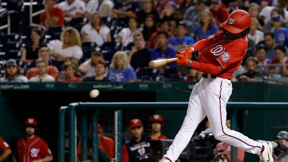  Aug 16, 2022; Washington, District of Columbia, USA; Washington Nationals shortstop CJ Abrams (5) shortstop CJ Abrams (5) hits a game tying RBI single against the Chicago Cubs during the tenth inning at Nationals Park. Mandatory Credit: Geoff Burke-USA TODAY Sports | USA TODAY Sports 