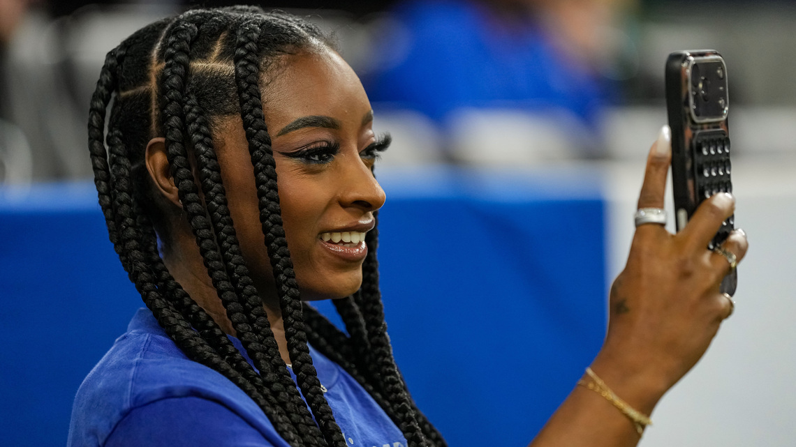 Simone Biles dons blinged out 2-piece set at Colts game in London 