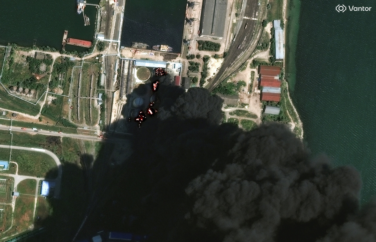 A satellite image shows fire and smoke rising from oil tanks, after what Ukrainian President Volodymyr Zelenskiy said was an attack on an oil depot in the city of Kerch, Crimea, June 21, 2026. Vantor/Handout via REUTERS.