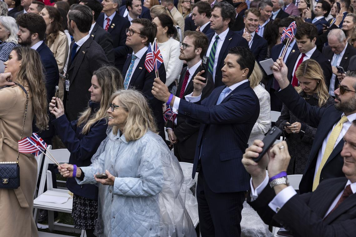 Attendees hold American and British flags at an arrival ceremony for King Charles III and Queen Camilla on the South Lawn of the White House in Washington, on Tuesday, April 28, 2026. (Anna Rose Layden/The New York Times)