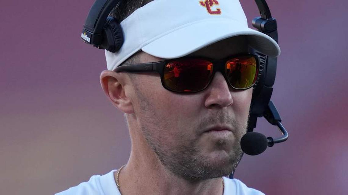  Oct 21, 2023; Los Angeles, California, USA; Southern California Trojans head coach Lincoln Riley watches from the sidelines against the Utah Utes in the first half at United Airlines Field at Los Angeles Memorial Coliseum. Mandatory Credit: Kirby Lee-Imagn Images | Kirby Lee-Imagn Images 
