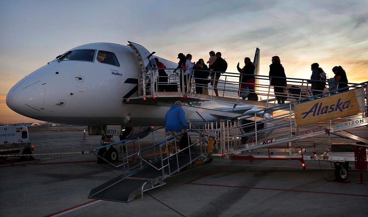 Passengers board Alaska Airlines’ new daily flight between the Tri-Cities Airport in Los Angeles International Airport on Tuesday morning in Pasco. The 76-seat Embraer carrying 48 travelers plus crew departed shortly after sunrise.