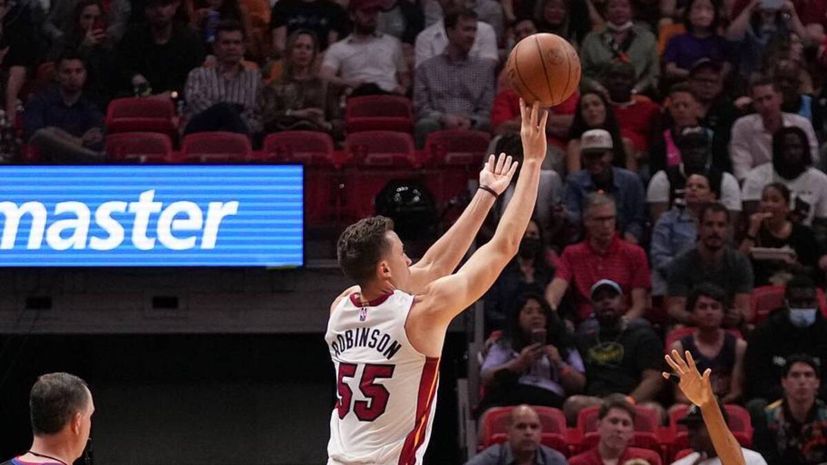  Mar 9, 2022; Miami, Florida, USA; Miami Heat guard Duncan Robinson (55) attempts a three point shot against the Phoenix Suns during the first half at FTX Arena. Mandatory Credit: Jasen Vinlove-USA TODAY Sports | IMAGN IMAGES via Reuters Connect 