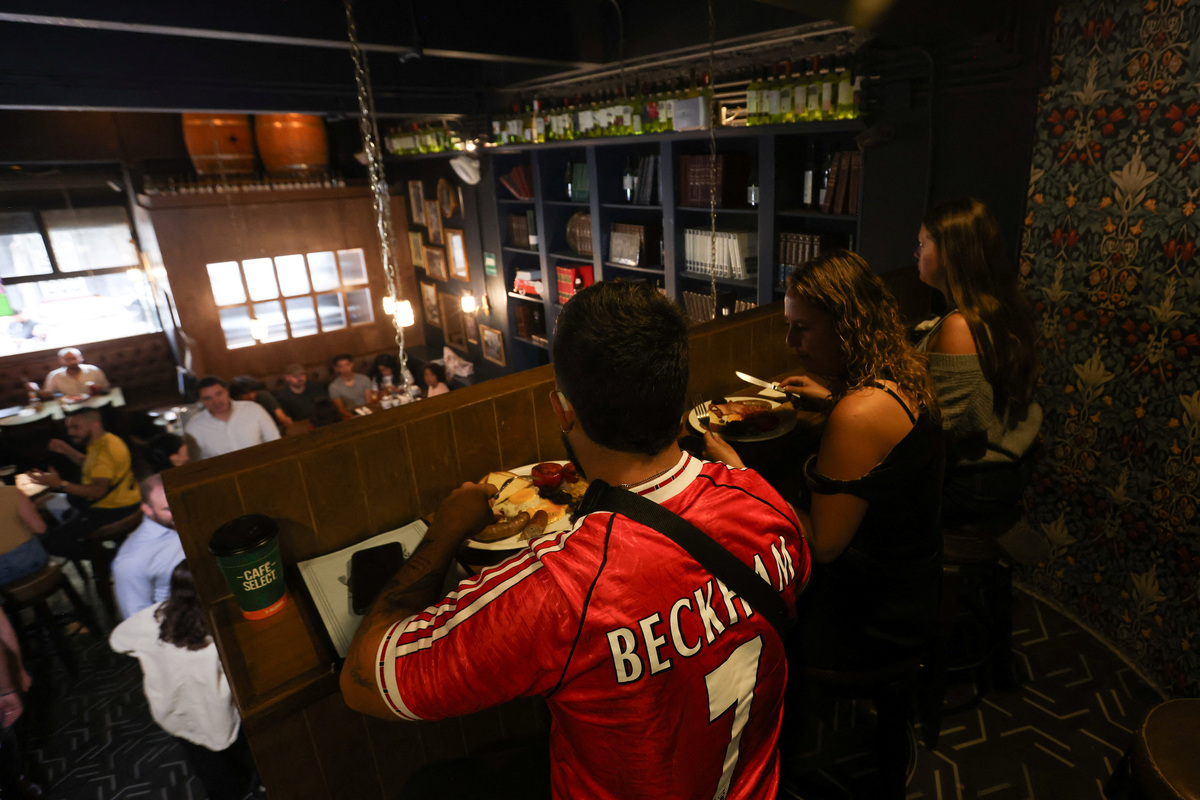 People watch a FIFA World Cup 2026 match at the Duke of Lisbon pub, a British-Mexican bar, that expects to see fans gather to watch the match between Mexico and England in the World Cup Round of 16, in Mexico City, Mexico, July 3, 2026. REUTERS/Quetzalli Nicte-Ha