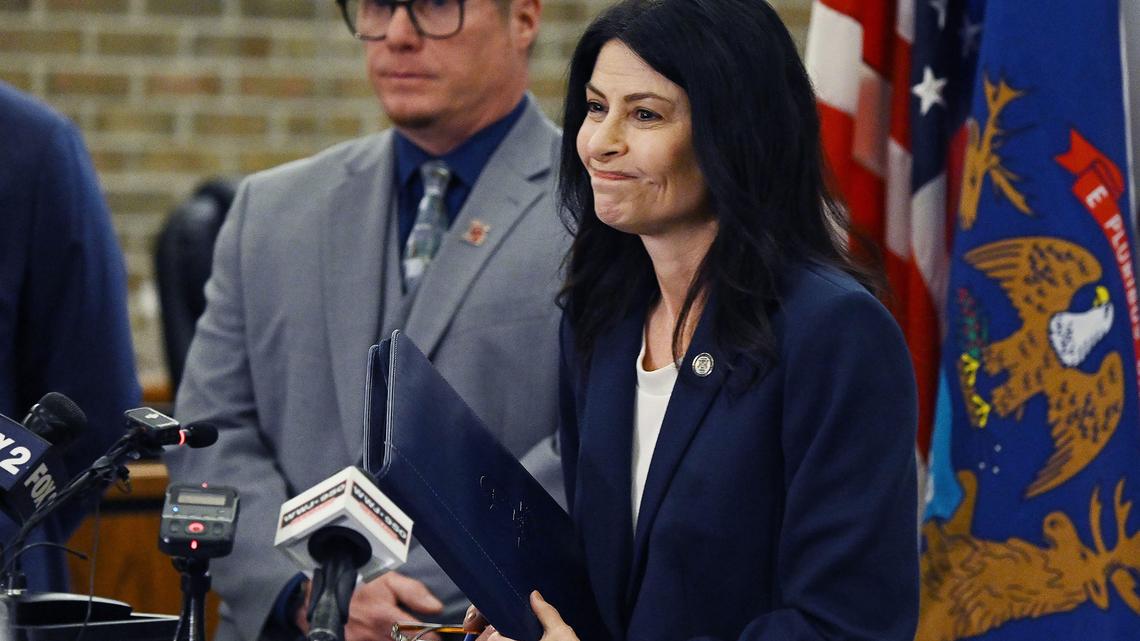 Michigan Attorney General Dana Nessel, Romulus, Mich., Mayor Robert McCraight and state Rep. Dylan Wegela (D-Garden City) during a news conference at Romulus City Hall in March 2026 to announce a lawsuit challenging ICE's conversion of the warehouse to a detention center. (Clarence Tabb Jr./The Detroit News/TNS)