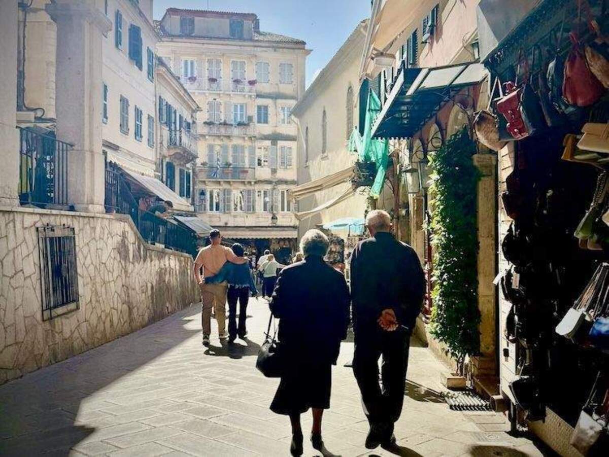  Joining the locals for their traditional evening passeggiata in Corfu, we watched this couple share a quiet walk they've likely taken for decades. Without peak-season crowds, we were able to truly observe everyday life instead of competing with it. Photo credit: Sharon Kurtz 