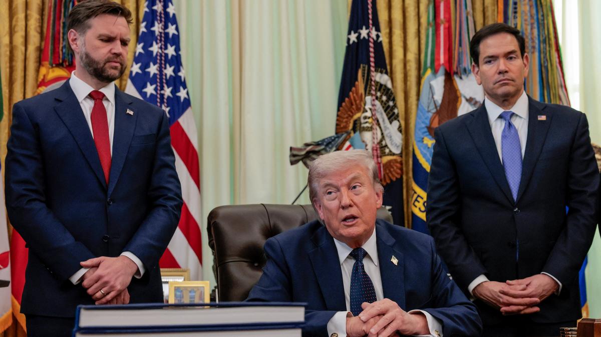 U.S. President Donald Trump speaks in the Oval Office, with Vice President JD Vance and Secretary of State Marco Rubio standing behind him, at the White House in Washington, D.C., U.S., April 23, 2026. REUTERS/Kylie Cooper
