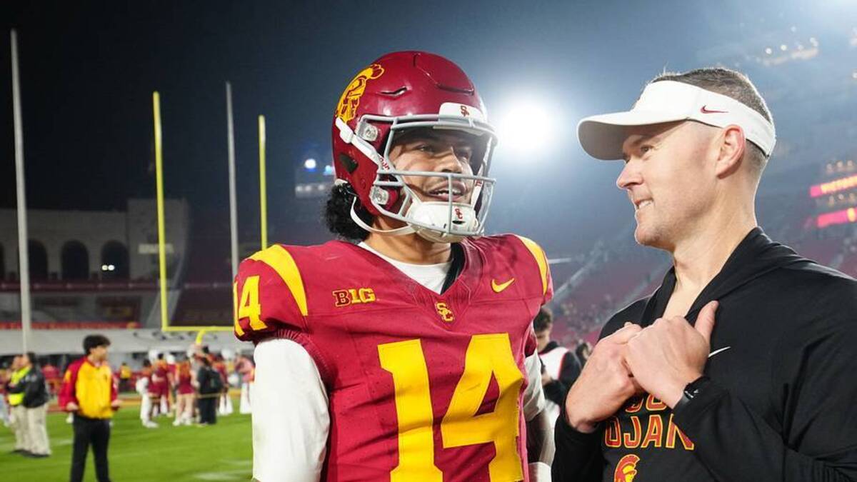  Nov 29, 2025; Los Angeles, California, USA; Southern California Trojans quarterback Jayden Maiava (14) and head coach Lincoln Riley react after the game against the UCLA Bruins at United Airlines Field at Los Angeles Memorial Coliseum. Mandatory Credit: Kirby Lee-Imagn Images | IMAGN IMAGES via Reuters Connect 