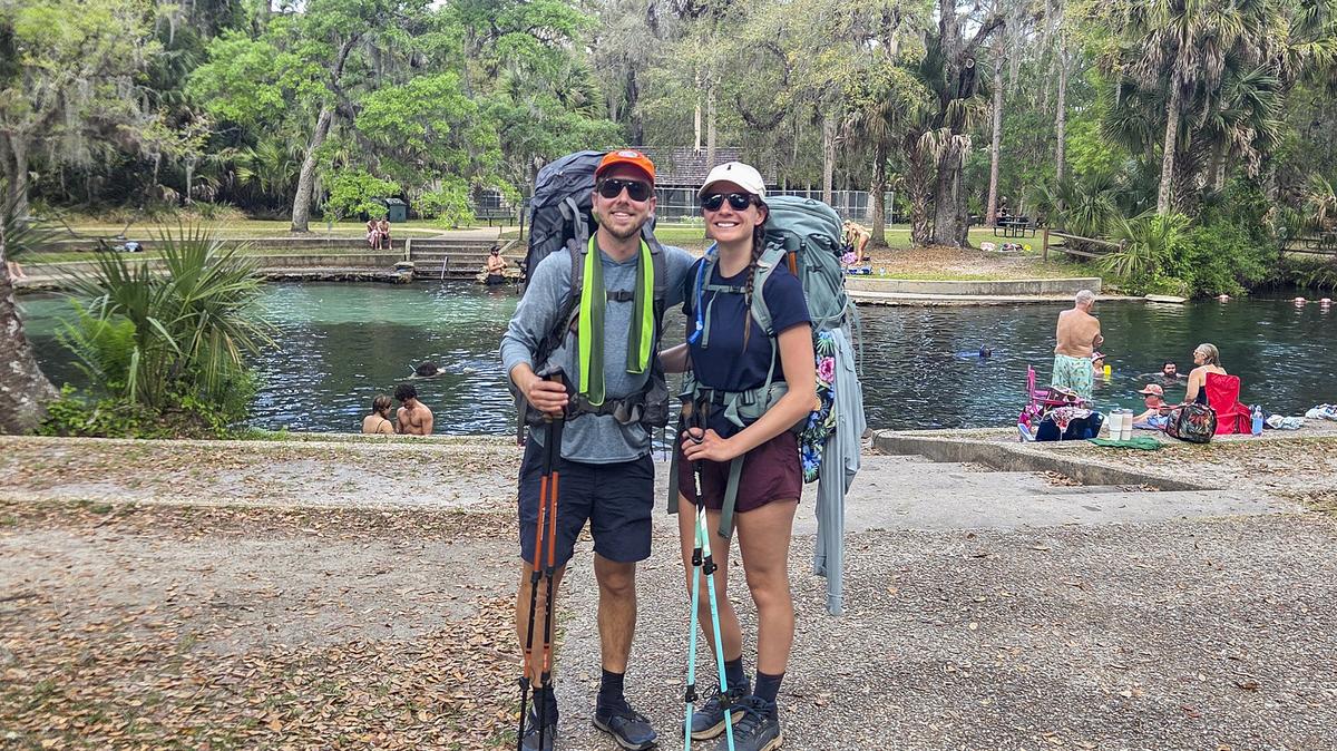 Patrick Connolly and Karissa Bellile take a much-needed break at Juniper Springs while hiking the Florida Trail through Ocala National Forest on April 3, 2026. (Patrick Connolly/Orlando Sentinel/TNS)
