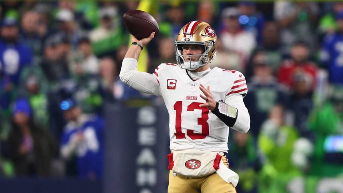  Jan 17, 2026; Seattle, WA, USA; San Francisco 49ers quarterback Brock Purdy (13) throws downfield against the Seattle Seahawks during the first half in an NFC Divisional Round game at Lumen Field. Mandatory Credit: Kevin Ng-Imagn Images | IMAGN IMAGES via Reuters Connect 