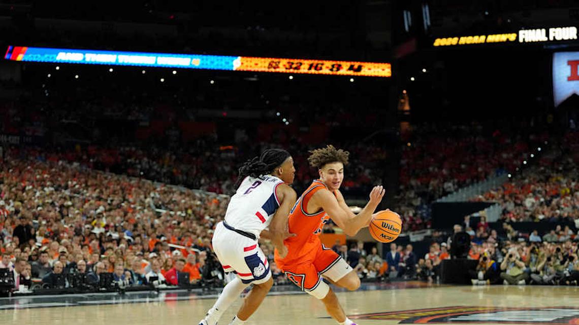  Apr 4, 2026; Indianapolis, IN, USA; Illinois Fighting Illini guard Keaton Wagler (23) dribbles the ball against UConn Huskies guard Silas Demary Jr. (2) during the first half of a semifinal of the Final Four of the men's 2026 NCAA Tournament at Lucas Oil Stadium. Mandatory Credit: Bob Donnan-Imagn Images | Bob Donnan-Imagn Images 