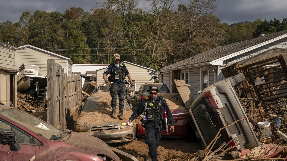 FEMA workers look through the wreckage after Hurricane Helene, in Swannanoa, N.C., Oct. 6, 2024.