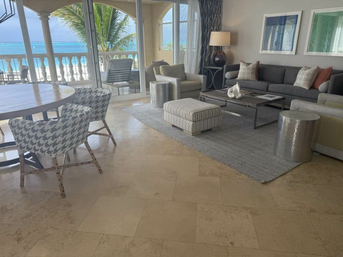 Cozy, homelike living room with a view inside a suite at Grace Bay Club. Photo credit: Jill Robbins