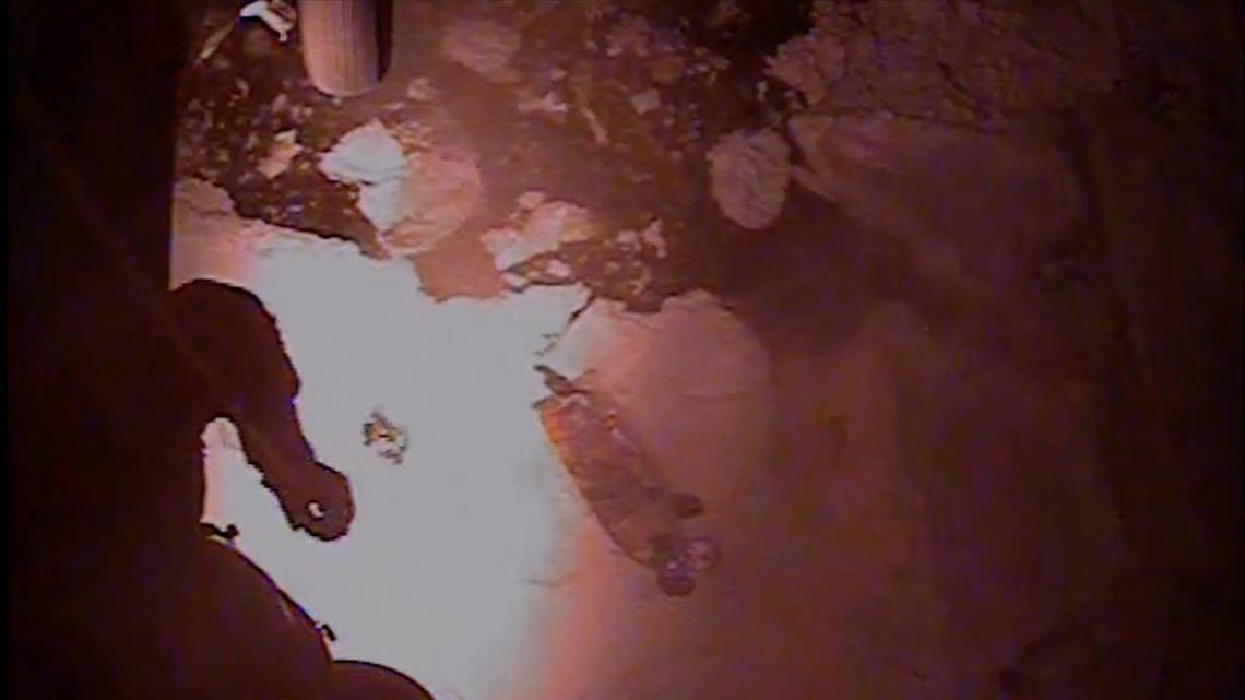 In a screengrab from a U.S Coast Guard video, an MH-60 Jayhawk helicopter aircrew from Coast Guard Air Station Kodiak rescues three adults and one child from an 18-foot vessel, right, that was trapped on an ice floe approximately 10 miles west of Chefornak, Alaska, on April 14, 2026. (U.S. Coast Guard/TNS)