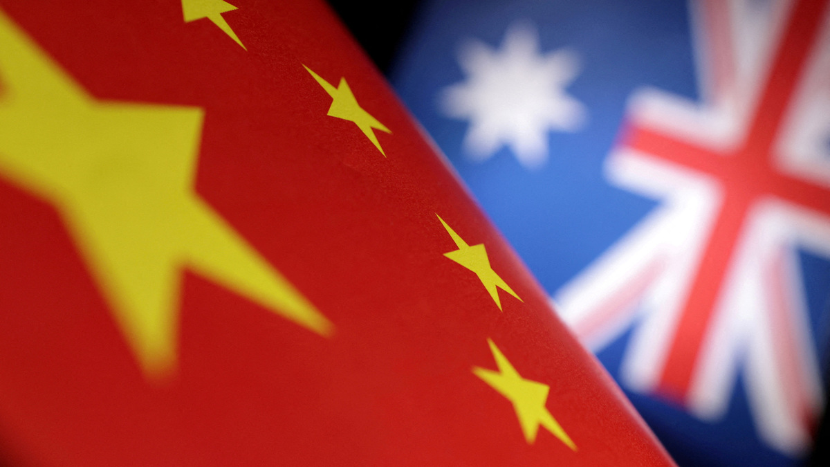 FILE PHOTO: Printed Chinese and Australian flags are seen in this illustration, July 21, 2022. REUTERS/Dado Ruvic/Illustration/File Photo
