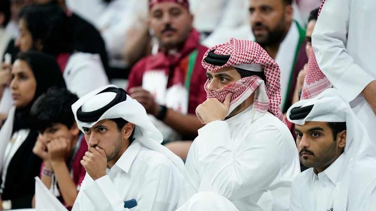  Qatar fans sometimes wear traditional thobes and ghutras. | Jabin Botsford/The Washington Post/Getty Images 