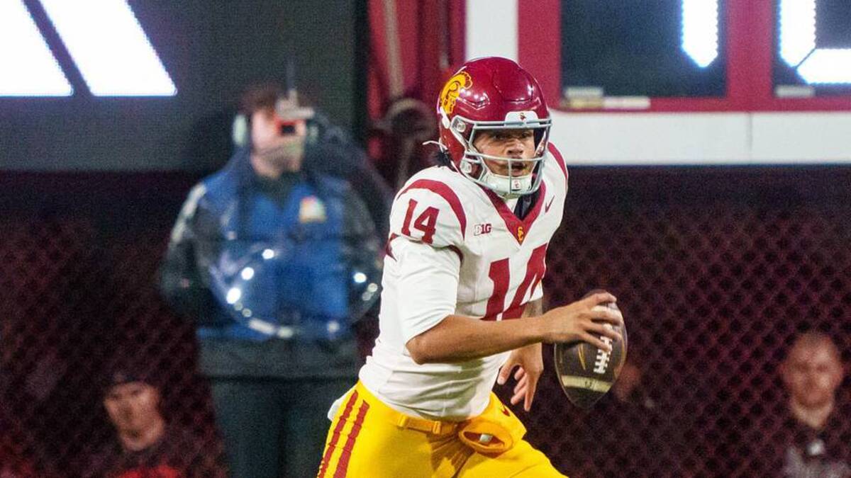  Nov 1, 2025; Lincoln, Nebraska, USA; Southern California Trojans quarterback Jayden Maiava (14) scrambles against the Nebraska Cornhuskers during the first quarter at Memorial Stadium. Mandatory Credit: Dylan Widger-Imagn Images | Dylan Widger-Imagn Images 