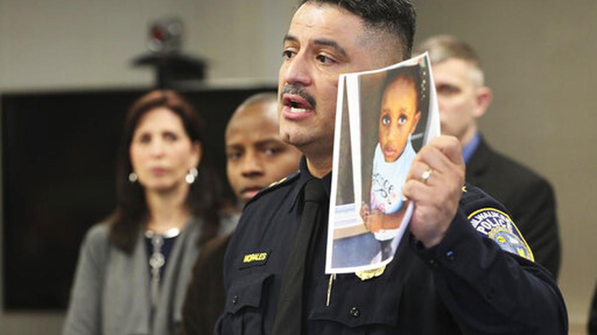 In this Friday, March 15, 2019, photo, Milwaukee Police Chief Alfonso Morales holds a photo of 2-year-old Noelani Robinson as he speaks at a news conference at the Police Administration Building in Milwaukee. A child’s body found wrapped in a blanket along a Minnesota highway is believed to be that of Noelani, a missing 2-year-old girl whose mom police have said was fatally shot by her former pimp, authorities announced Saturday.