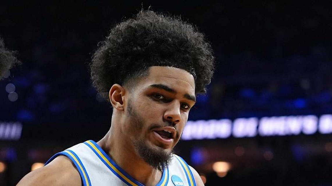  Mar 20, 2026; Philadelphia, PA, USA; UCF Knights forward Jamichael Stillwell (4) grabs a rebound against UCLA Bruins guard Eric Freeny (8) in the second half during a first round game of the men's 2026 NCAA Tournament at Xfinity Mobile Arena. Mandatory Credit: Kyle Ross-Imagn Images | Kyle Ross-Imagn Images 