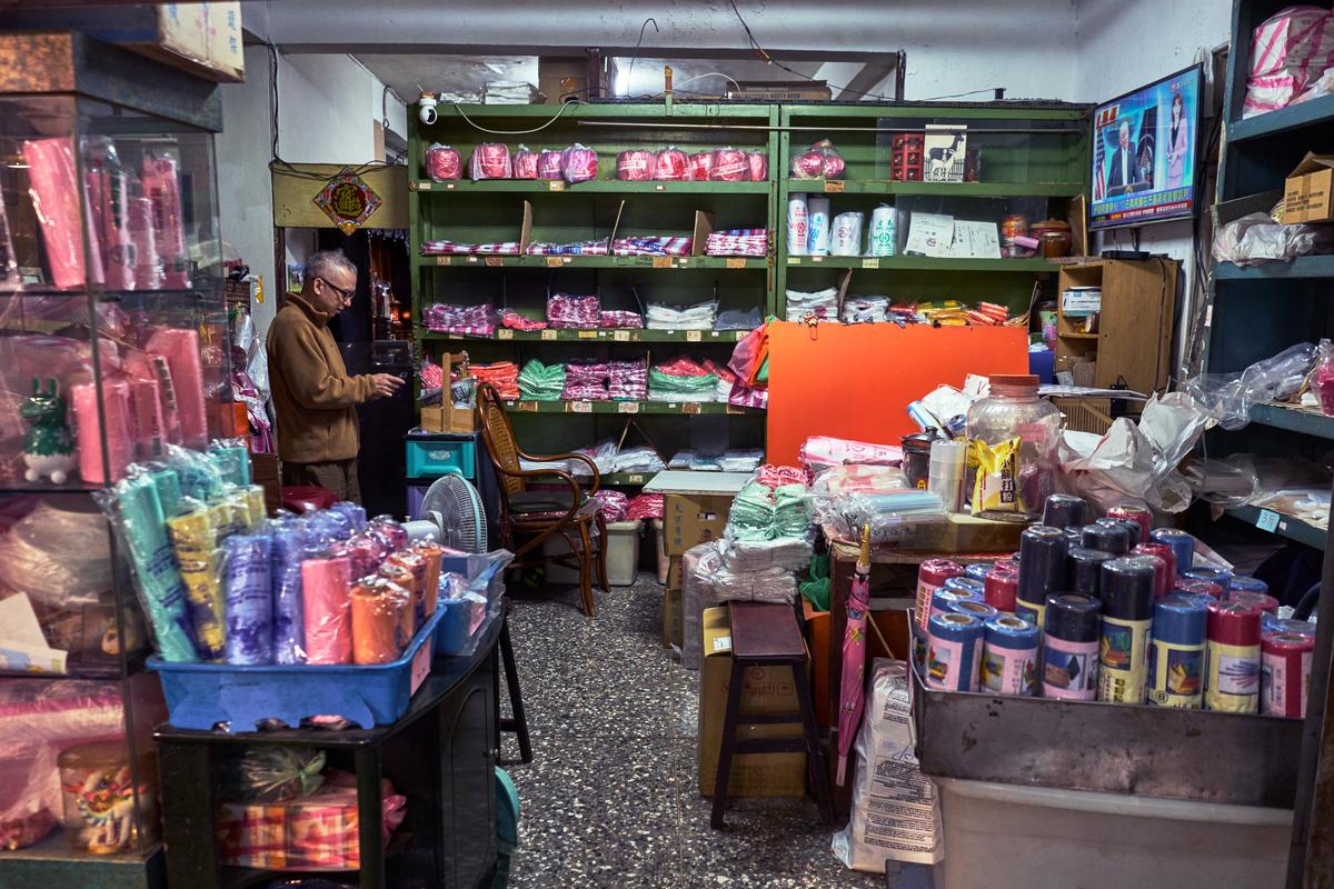 Yu Chih-ta, who with his mother have spent decades running a shop that sells plastic bags and containers to small businesses, including food vendors, in New Taipei City, Taiwan on April 8, 2026. Plastic producers in Taiwan have scrambled to secure new supplies since the war in Iran disrupted petrochemical flows and tightened availability. (An Rong Xu/The New York Times)
