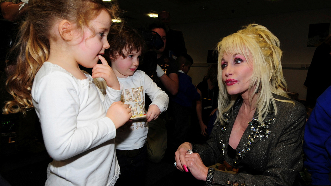 Dolly Parton's legacy lives on through book deliveries to kids 