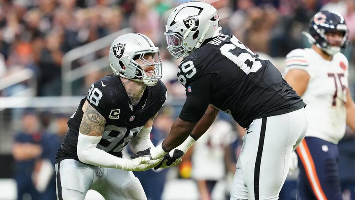  Sep 28, 2025; Paradise, Nevada, USA; Las Vegas Raiders defensive end Maxx Crosby (98) celebrates a play with defensive tackle Adam Butler (69) during the second half against the Chicago Bears at Allegiant Stadium. Mandatory Credit: Stephen R. Sylvanie-Imagn Images | Stephen R. Sylvanie-Imagn Images 