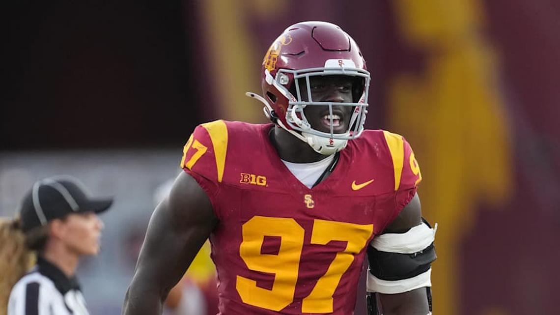  Aug 30, 2025; Los Angeles, California, USA; Southern California Trojans defensive tackle Jide Abasiri (97) celebrates after a sack as center judge referee Amanda Sauer watches against the Missouri State Bears in the second half at United Airlines Field at Los Angeles Memorial Coliseum. Mandatory Credit: Kirby Lee-Imagn Images | Kirby Lee-Imagn Images 