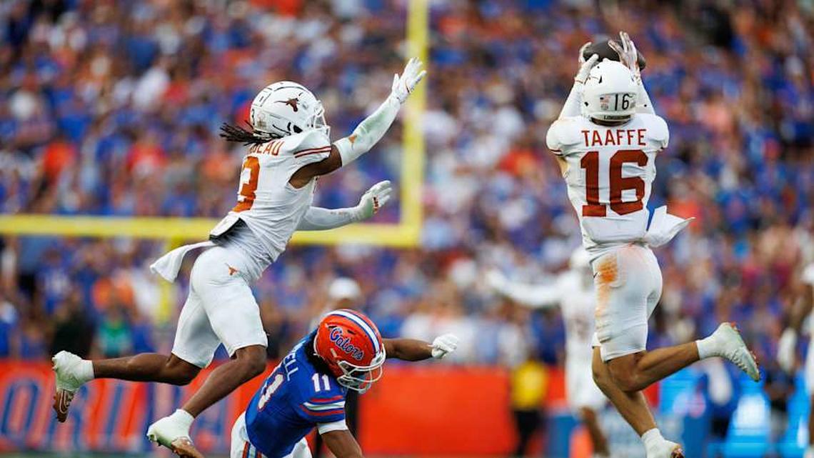  Oct 4, 2025; Gainesville, Florida, USA; Texas Longhorns defensive back Michael Taaffe (16) intercepts a pass to Florida Gators wide receiver Aidan Mizell (11) during the second half at Ben Hill Griffin Stadium. Mandatory Credit: Matt Pendleton-Imagn Images | Matt Pendleton-Imagn Images 