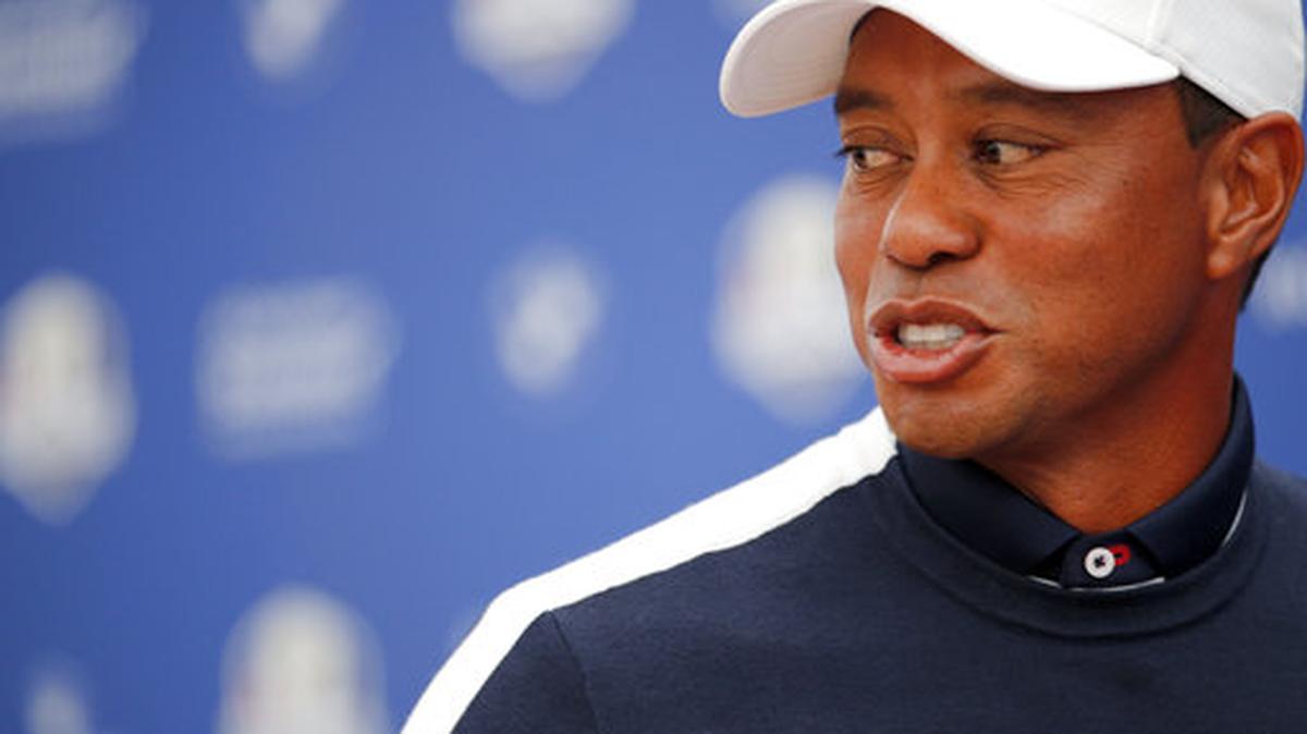 Tiger Woods of the US leave the stage after answering questions during a press conference as part of the 2018 Ryder Cup at Le Golf National in Saint-Quentin-en-Yvelines, outside Paris, France, Tuesday, Sept. 25, 2018. The 42nd Ryder Cup will be held in France from Sept. 28-30, 2018 at Le Golf National.