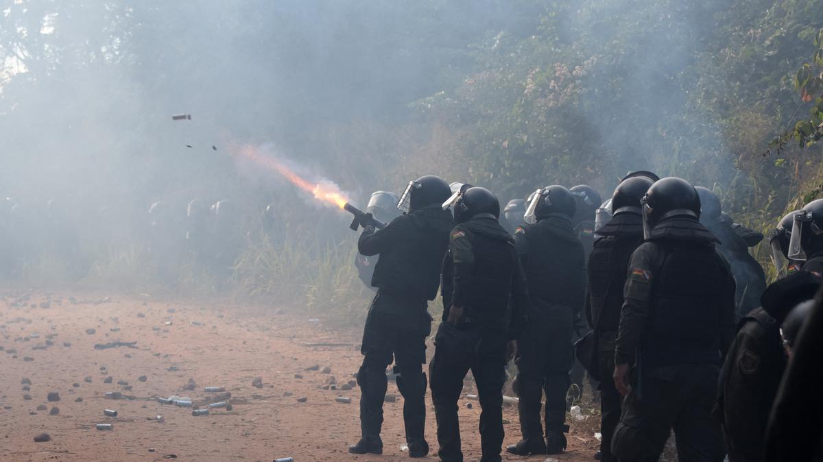 Police officers fire tear gas while clashing with community members who seized the Humberto Suarez oil facility to call for the resignation of President Rodrigo Paz, as ongoing protests have led to shortages of fuel and food, in Santa Rosa del Sara, Bolivia, June 3, 2026. REUTERS/Ipa Ibanez