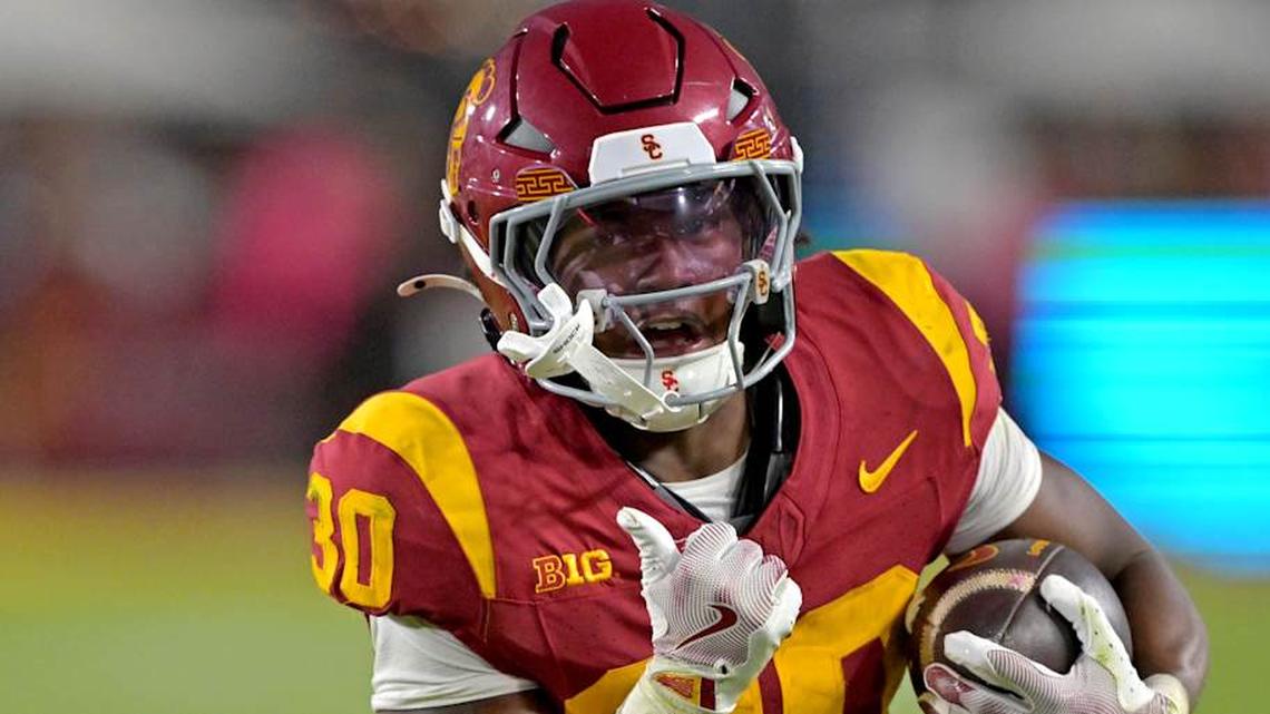  Oct 11, 2025; Los Angeles, California, USA; USC Trojans running back King Miller (30) runs for a touchdown in the second half against the Michigan Wolverines at United Airlines Field at the Los Angeles Memorial Coliseum. Mandatory Credit: Jayne Kamin-Oncea-Imagn Images | Jayne Kamin-Oncea-Imagn Images 