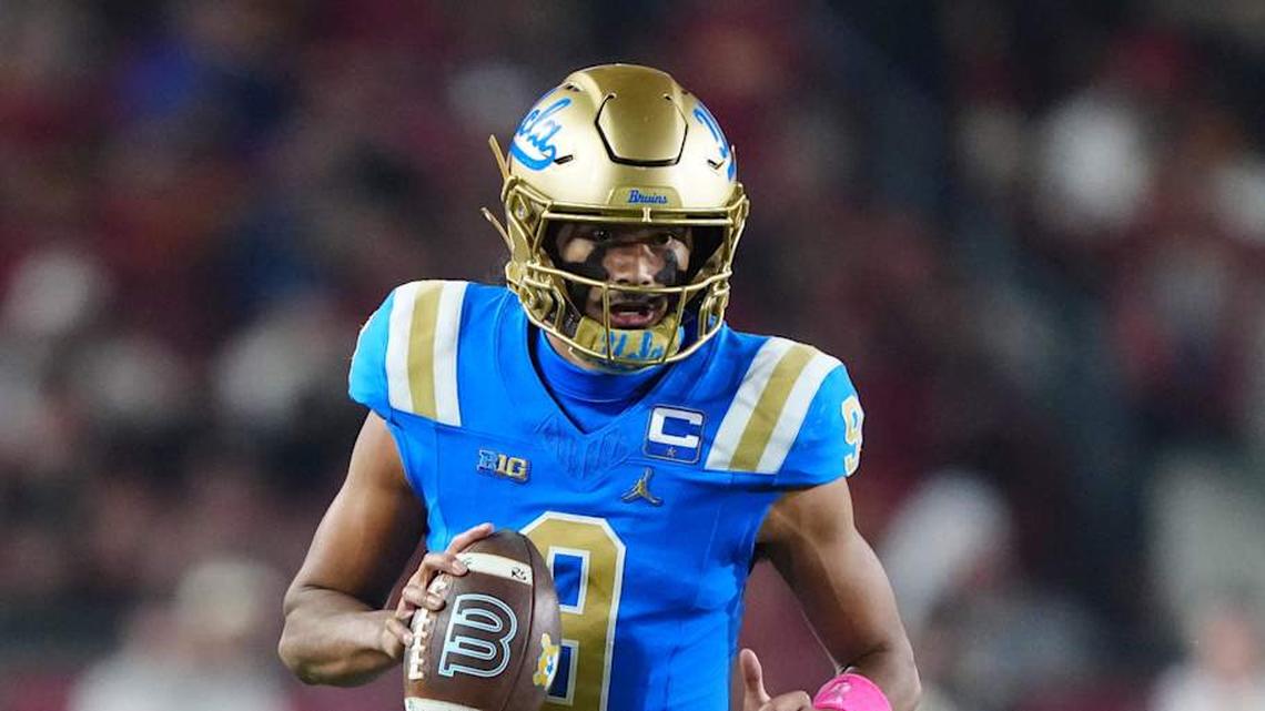  Nov 29, 2025; Los Angeles, California, USA; UCLA Bruins quarterback Nico Iamaleava (9) carries the ball against the Southern California Trojans in the first half at United Airlines Field at Los Angeles Memorial Coliseum. Mandatory Credit: Kirby Lee-Imagn Images | Kirby Lee-Imagn Images 