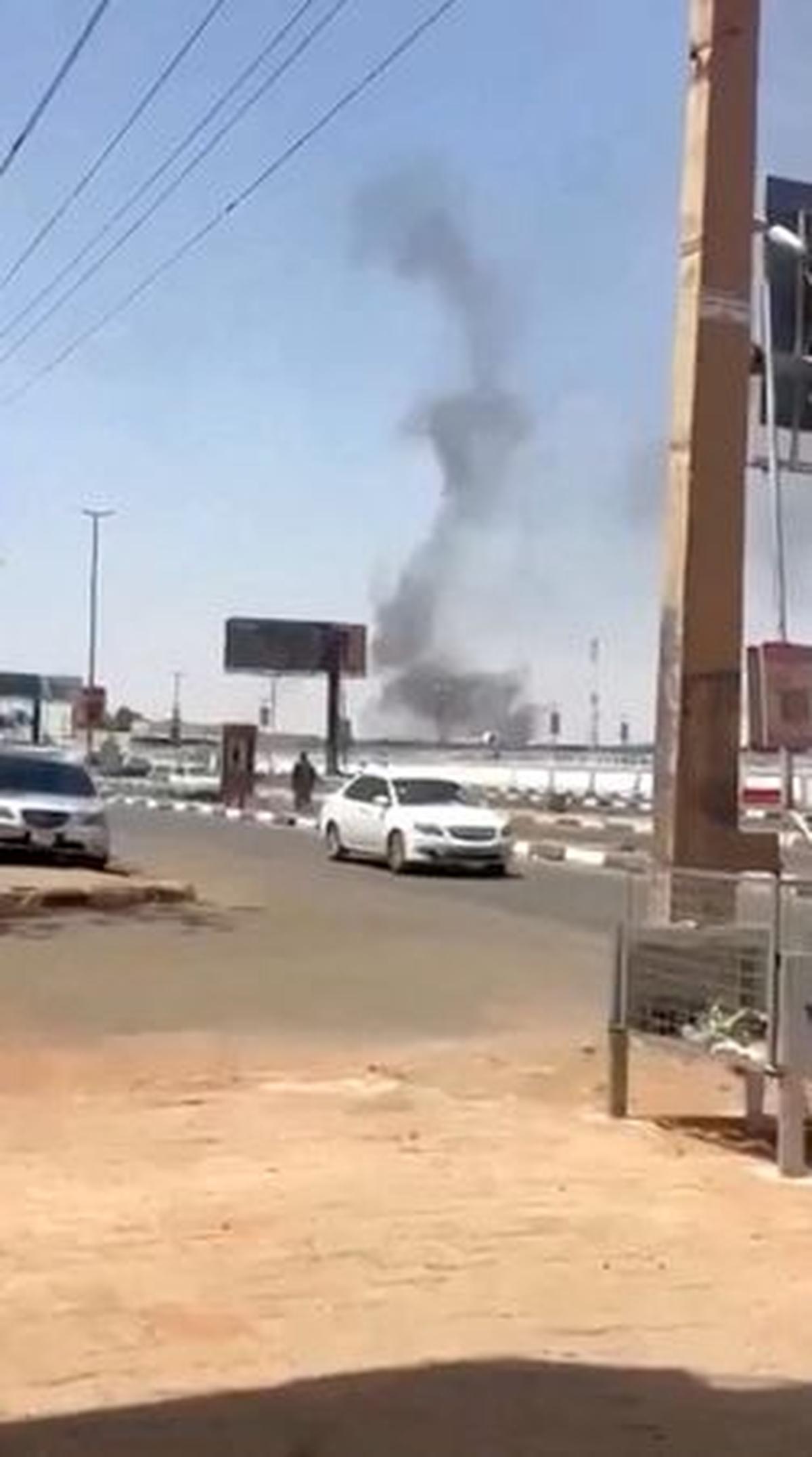 Smoke rises, following a drone attack in Khartoum airport, in Khartoum, Sudan, in this screengrab taken from social media video released on May 4, 2026. SOCIAL MEDIA/REUTERS TV via REUTERS  THIS IMAGE HAS BEEN SUPPLIED BY A THIRD PARTY. NO RESALES. NO ARCHIVES. NEWS USE ONLY.  Verified by:  - Road layout, utility poles, advertising poles, walls, solar panels, and buildings matched satellite imagery - The precise location from which the smoke originated could not be verified, but the videos were filmed in the direction of Khartoum airport - Date not verified; however, no older versions of the videos were found posted online before May 4 - Eyewitnesses told Reuters on Monday, May 4, that a drone strike targeted the country’s main airport  - Media reported on May 4 that a drone targeted Khartoum airport