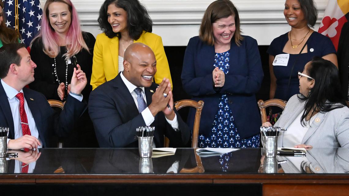 Front, from left, Maryland Senate President Bill Ferguson, Gov. Wes Moore and House Speaker Joseline Peña-Melnyk react during the signing of HB 637/SB 385, the "Vax Act" in the Governor’s Reception Room. (Kim Hairston/The Baltimore Sun/TNS)