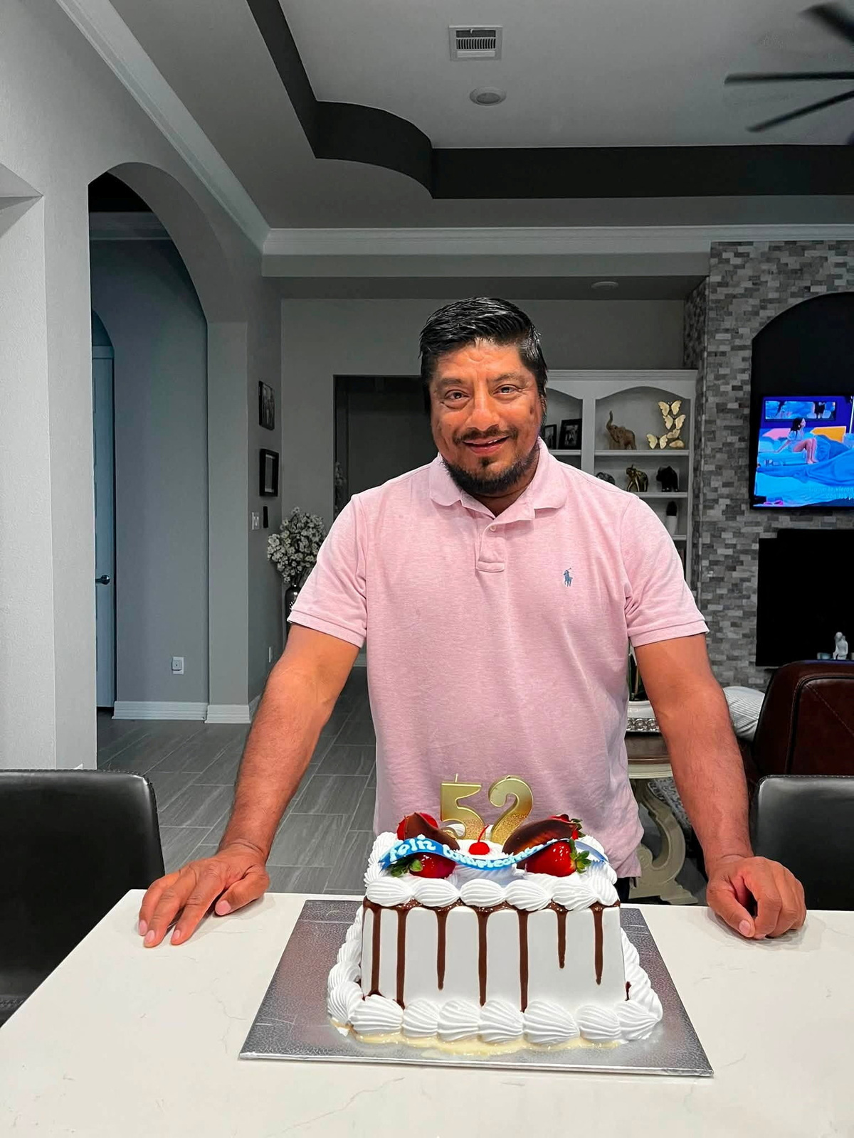 Lorenzo Salgado Araujo, a Mexican motorist who was fatally shot by an ICE agent during a vehicle stop in Houston, stands behind a birthday cake in an unknown location in this this picture obtained from social media, released July 8, 2026. Ronaldo Salgado/via REUTERS